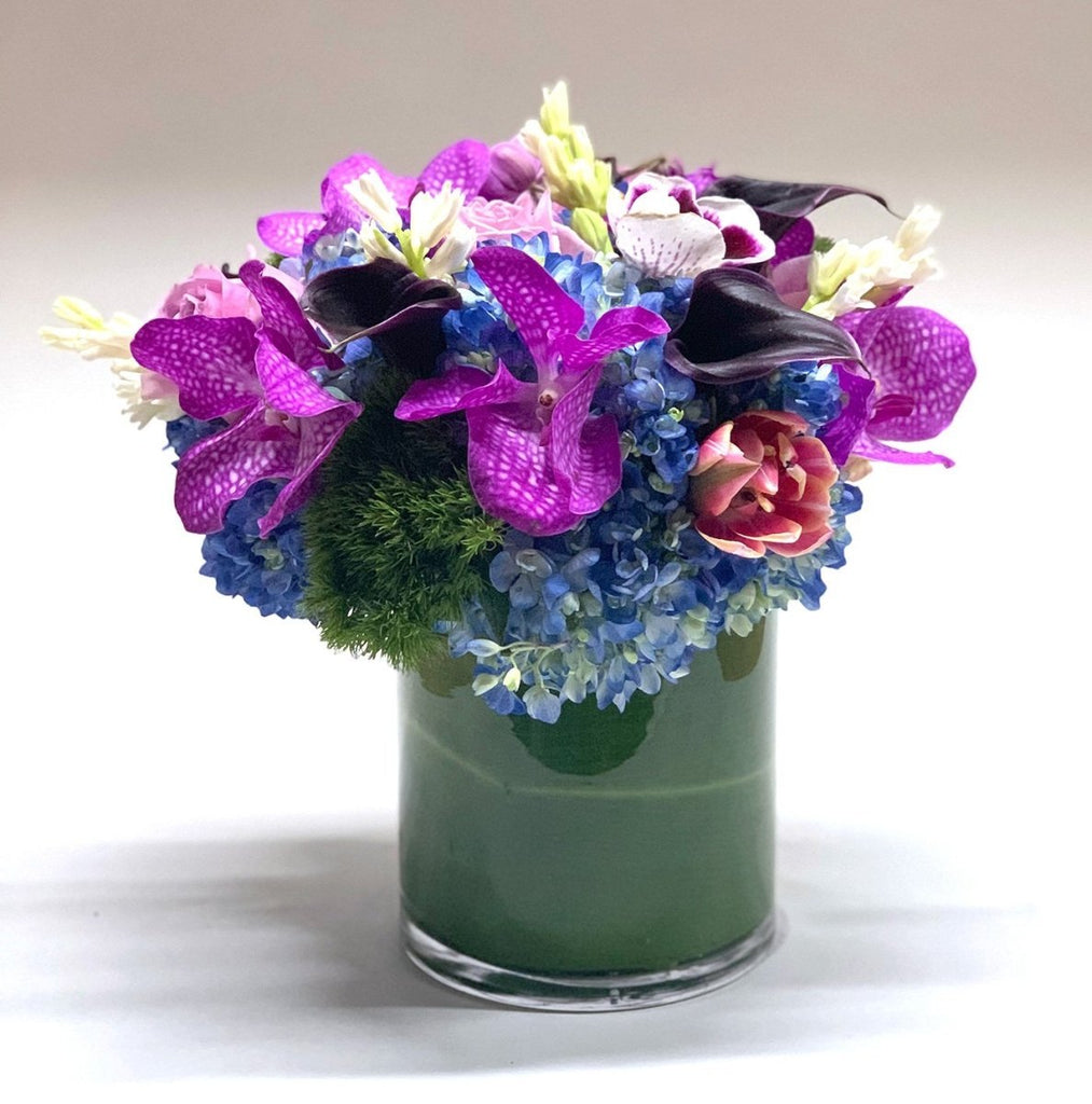 Blueberry Delight flower arrangement by Heather Floral, featuring Vanda orchids and Calla lilies